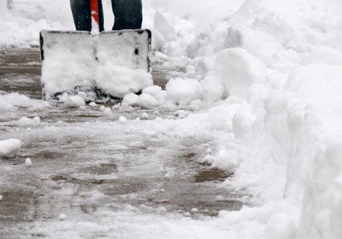 Person with shovel Snow Removal Washington IL