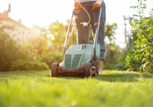 A team member of Mobeck Lawn & Landscape mows a lawn. It's just one of the services the team offers in addition to Backyard Landscaping in East Peoria IL.